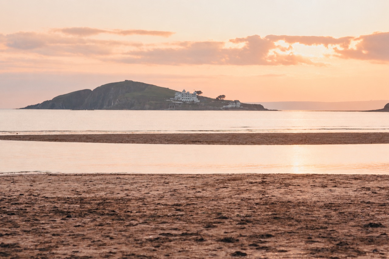 Burgh Island viewed across the beach at sunset