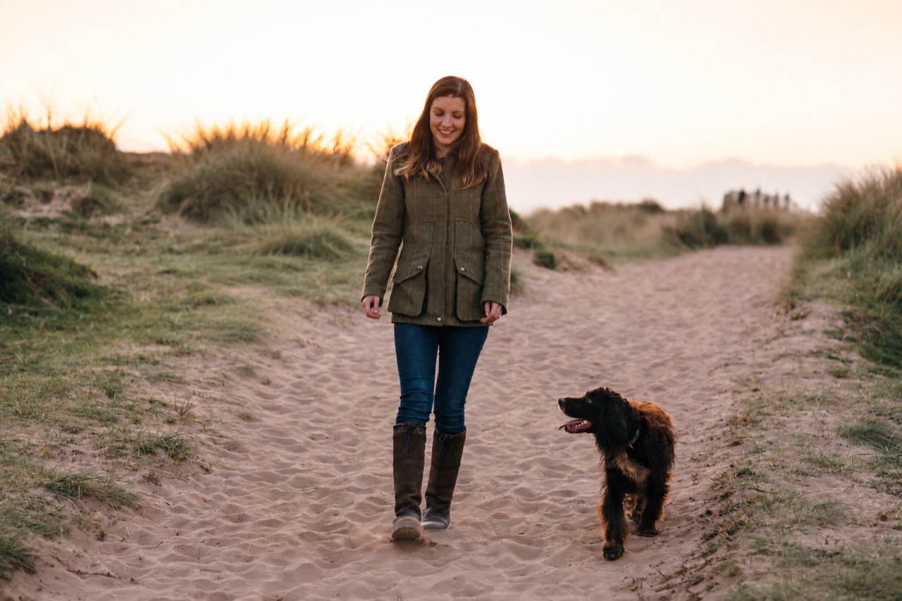 Vikki walking with her dog at Bantham Beach